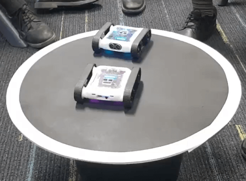 Two Rovers facing off in a sumo arena