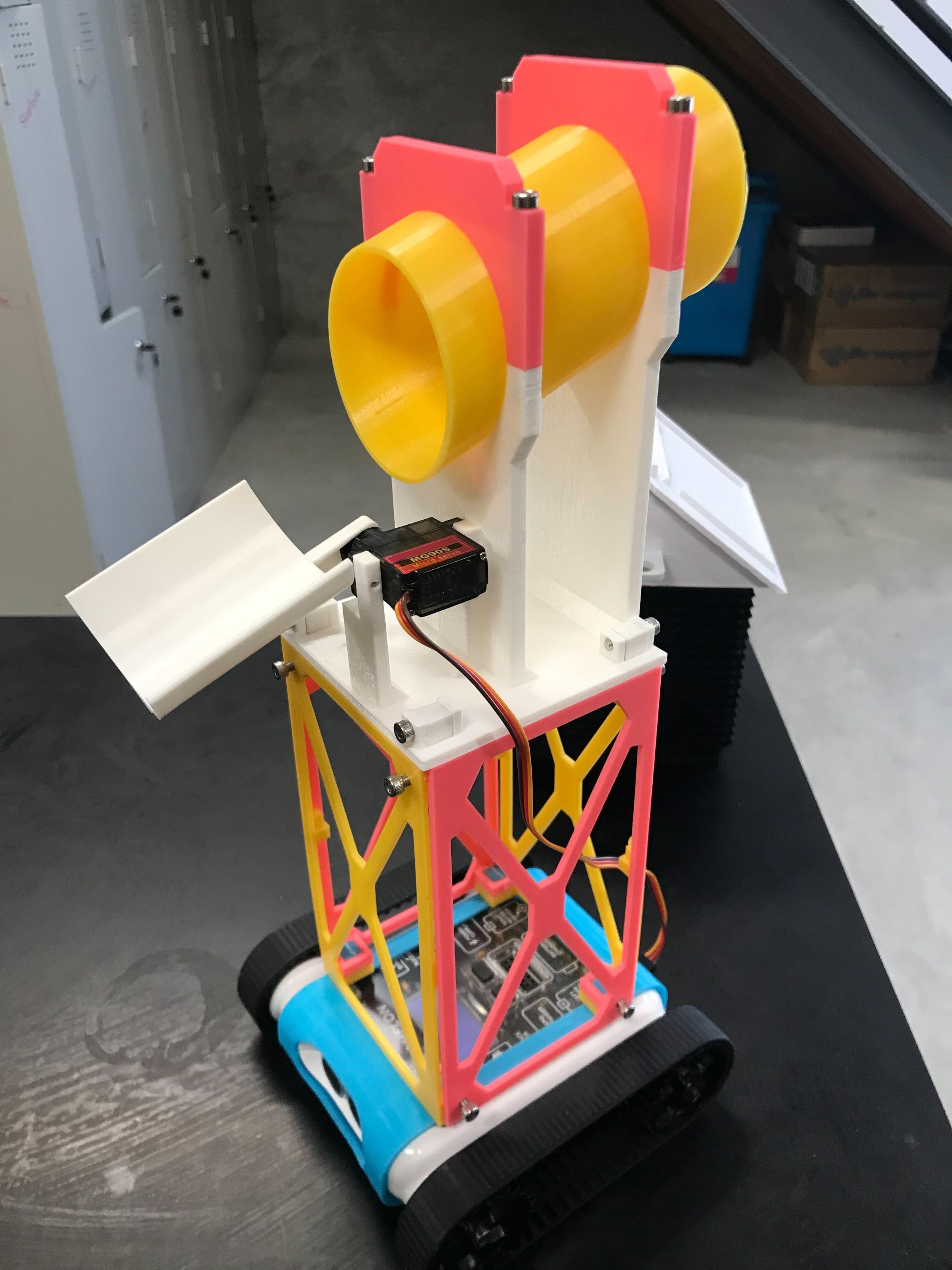 3D-printed line-follow attachment with ball container and servo release